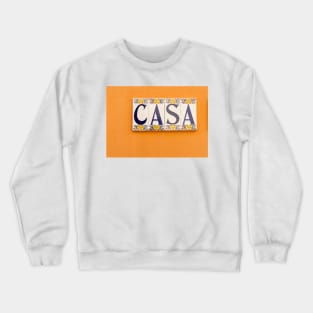 Village street in old Spanish town with Spanish word CASA in tiles on orange wall Crewneck Sweatshirt